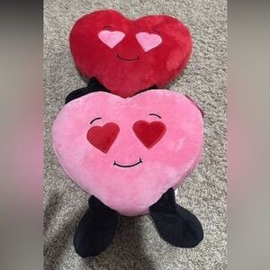 2 heart stuffed animals
